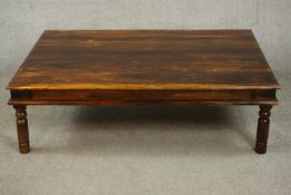 An Indian sheesham coffee table, late 20th century, of rectangular form with iron banding to the