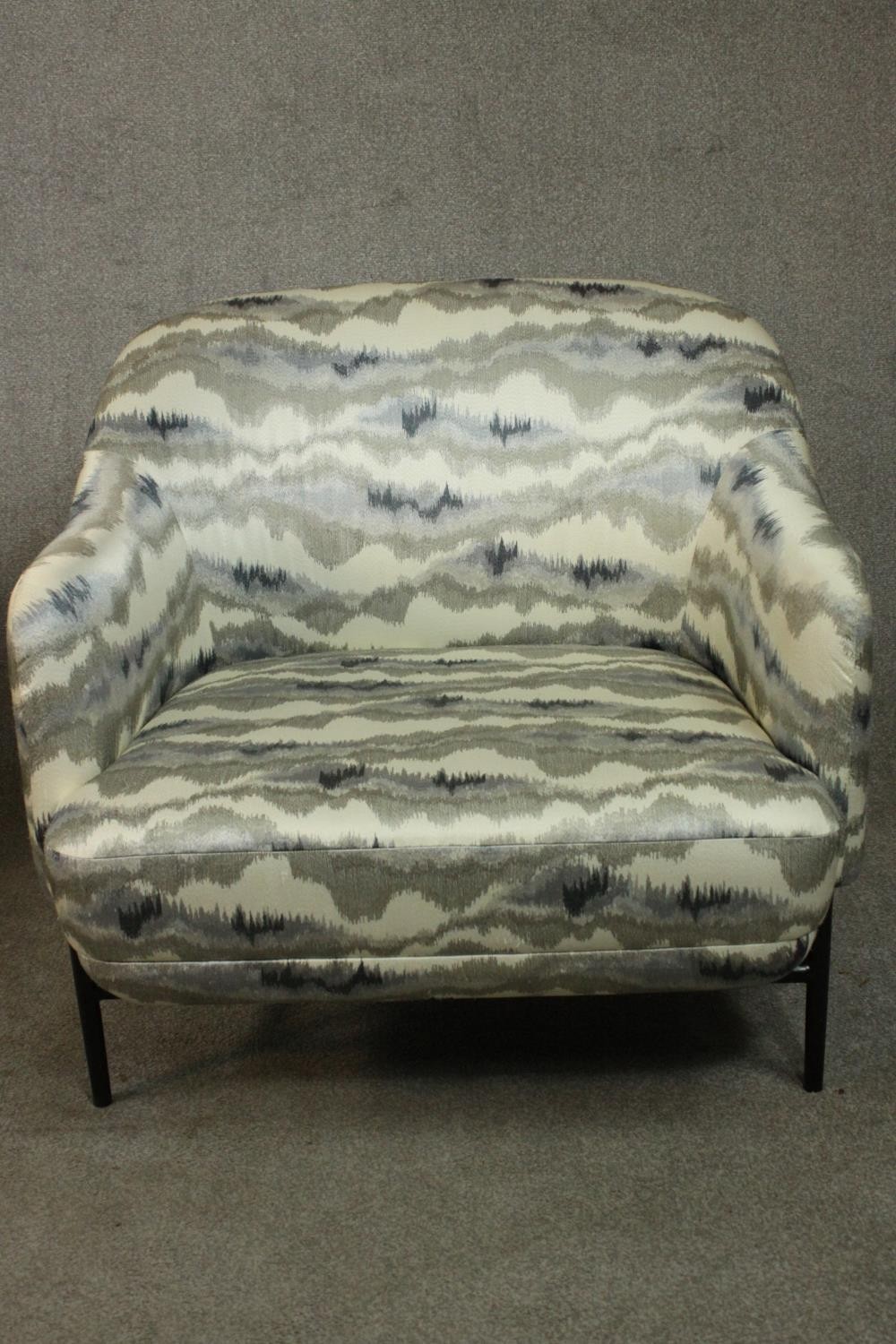 A pair of retro styled armchairs, with patterned upholstery in hues of grey, on a black powder - Image 4 of 13