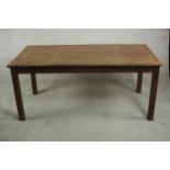 A contemporary teak garden dining table, with a rectangular slatted top on square section legs. H.69