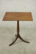 A 19th century walnut occasional table, the rectangular top with inlaid border, on a turned stem