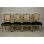 A set of four French Louis XVI style painted dining chairs, 19th century, with a caned back over a