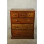 A late 19th century Colonial hardwood chest of three short over three long graduated drawers on a