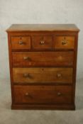 A late 19th century Colonial hardwood chest of three short over three long graduated drawers on a