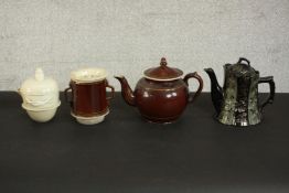 Two Victorian ceramic tea pots and white ceramic twin handled lidded sugar bowl. H.19 Dia.11cm. (