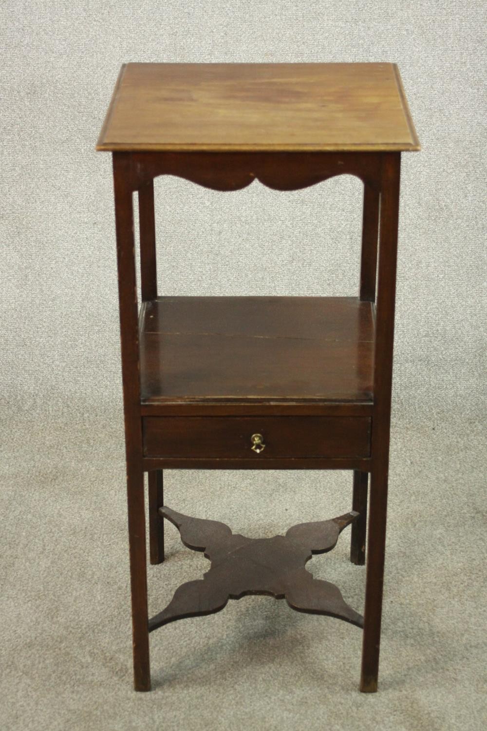 A 19th century mahogany washstand table, the square top with a moulded edge over an undertier with a