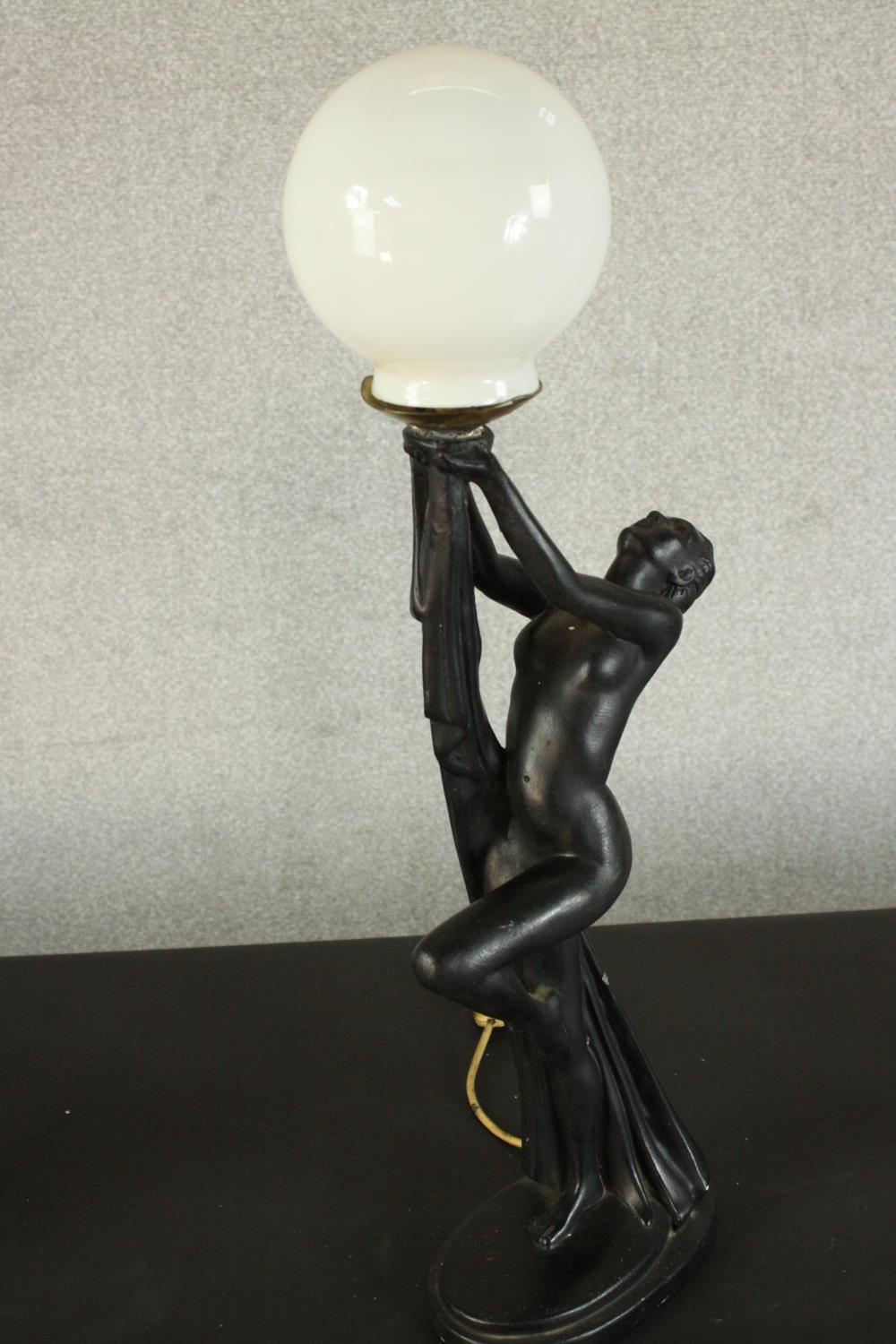 An Art Deco style black resin table lamp in the form of a nude dancer with white glass globe - Image 4 of 6