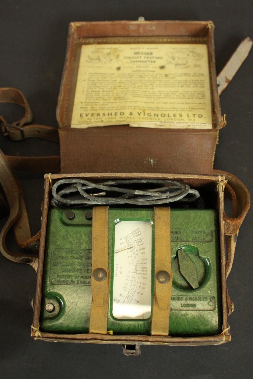 A vintage leather cased Megger circuit testing ohmmeter in green Bakelite, along with a vintage bell - Image 3 of 5