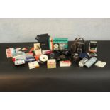 A collection of 35mm camera equipment and accessories. H.18 W.10 D.5cm. (largest)