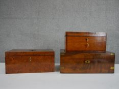 Two 19th Century mahogany tea caddies, the hinged tops enclosing a fitted interior one with a