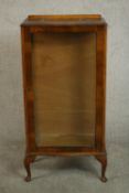 A circa 1930s walnut display cabinet, with a glazed door and sides, on cabriole legs. H.114 W.57 D.