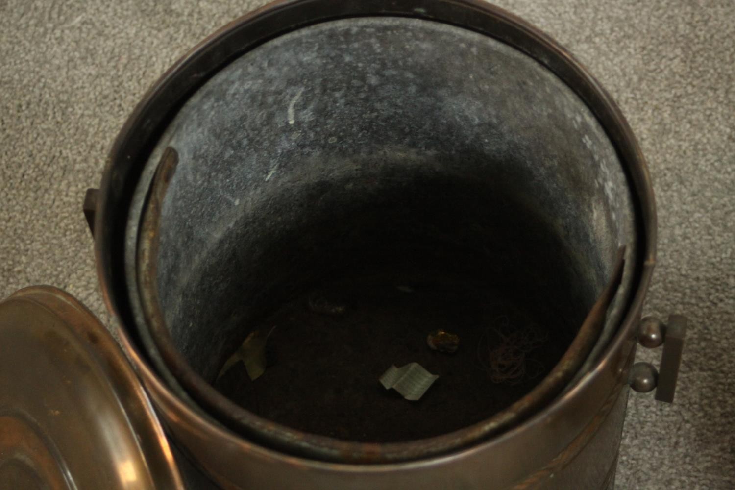 A brass coal bucket and a copper coal bucket, both of cylindrical form with a lid and two handles. - Image 5 of 6
