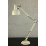 A Herbert Terry style white painted anglepoise desk lamp, on a circular weighted base. H.104 Dia.