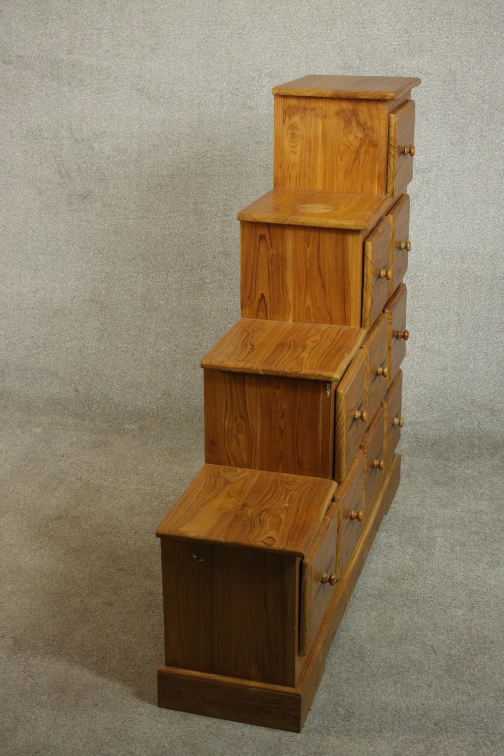 A contemporary pine stepped chest in the style of a Japanese kaidan tansu, with an arrangement of - Image 7 of 9