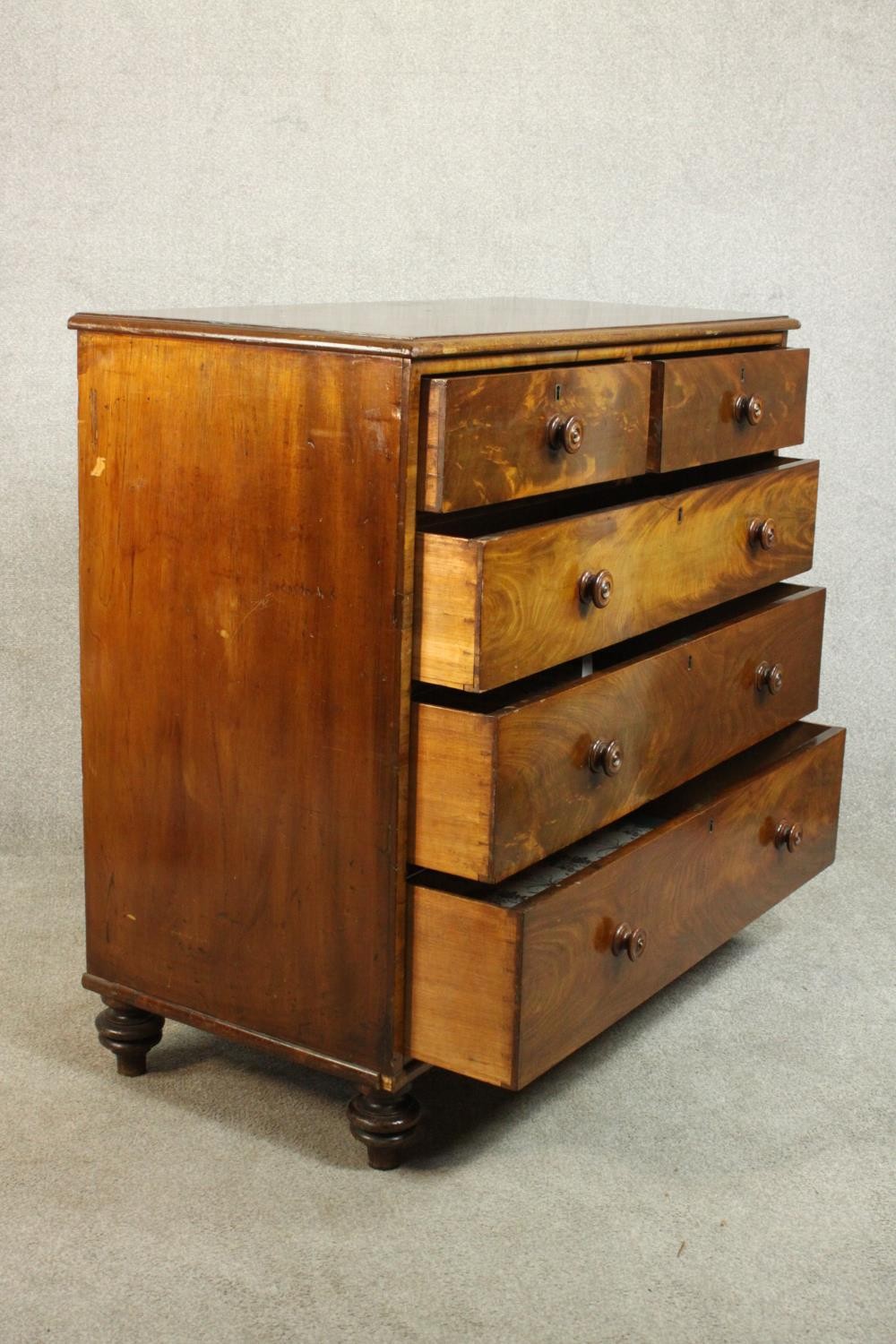 A 19th century flame mahogany chest of two short over three long drawers with knob handles, on - Image 7 of 8