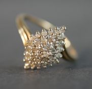 A 9 carat yellow gold and diamond cluster ring, set with thirty four round eight cut diamonds with a