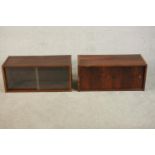 Two imitation Rosewood wall mounted cabinets with sliding glass doors. H.35 W.80 D.35cm. (each)