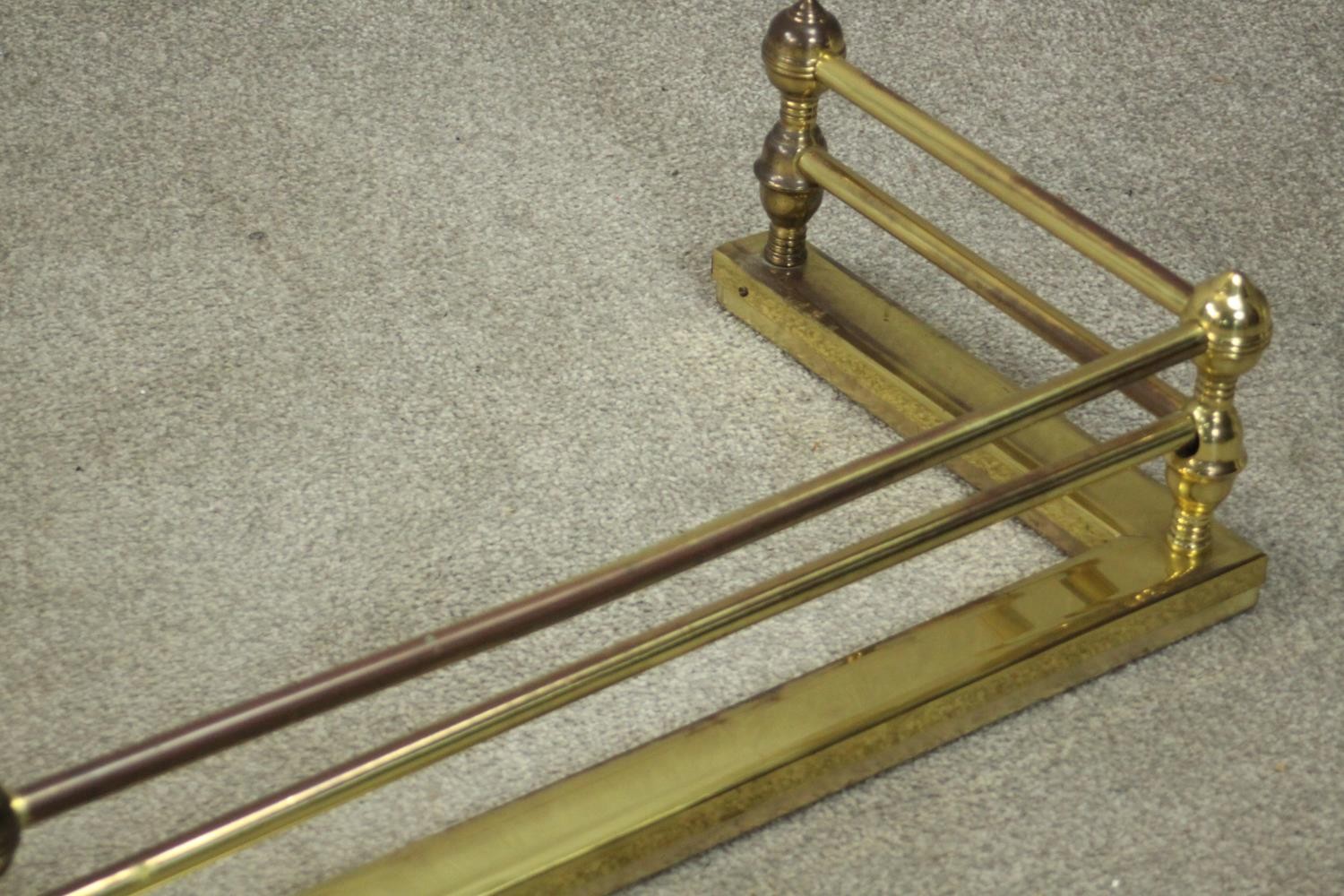 A Victorian brass fender of typical form with ball supports to the tubular rails. H.18 W.134 D.36cm. - Image 5 of 5