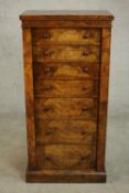 A Victorian figured walnut secretaire Wellington chest, with two drawers over a secretaire section