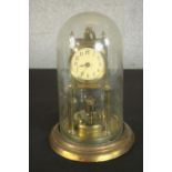A brass anniversary clock, 20th century, with Arabic numerals to the enamelled dial, under a plastic