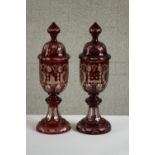 A pair of large 20th century Bohemian ruby flash goblets and covers, with engraved castle and bird