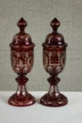 A pair of large 20th century Bohemian ruby flash goblets and covers, with engraved castle and bird