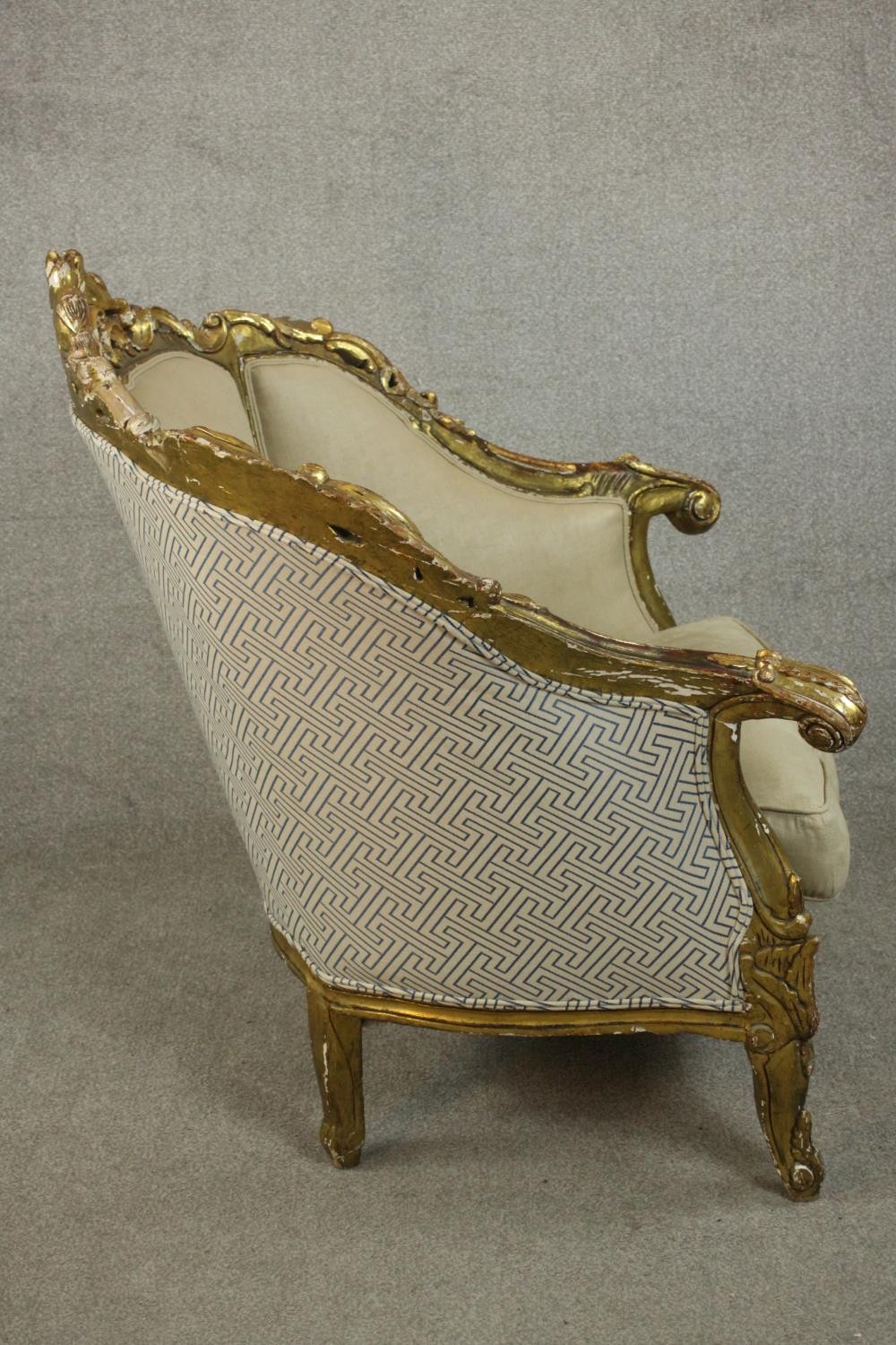 A pair of Louis XV style carved giltwood armchairs, 20th century, upholstered in beige fabric, - Image 4 of 10