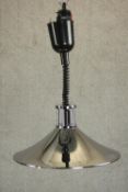 A polished chrome conical ceiling lamp with extendable coiled cable. H.90 Dia.37cm.
