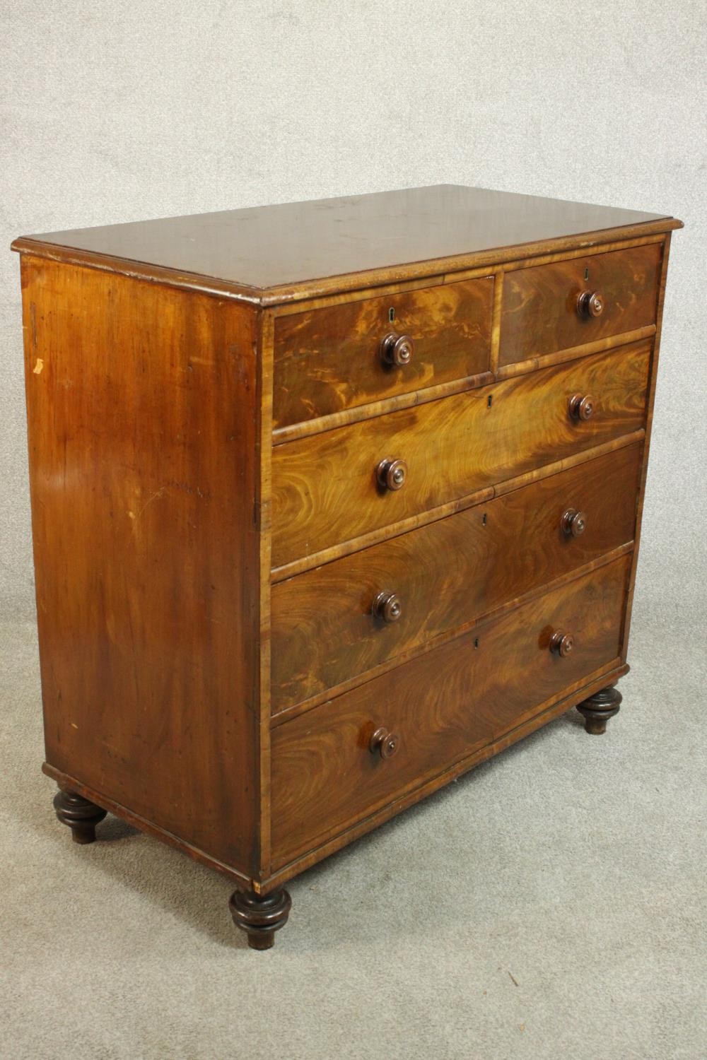 A 19th century flame mahogany chest of two short over three long drawers with knob handles, on - Image 4 of 8