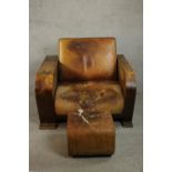 A Heal's style Art Deco brown leather armchair with integral book shelves to the side and rear,
