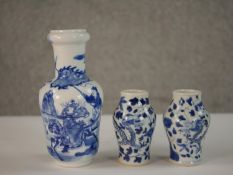 Three blue and white early 20th century hand painted porcelain Chinese vases, including a pair of