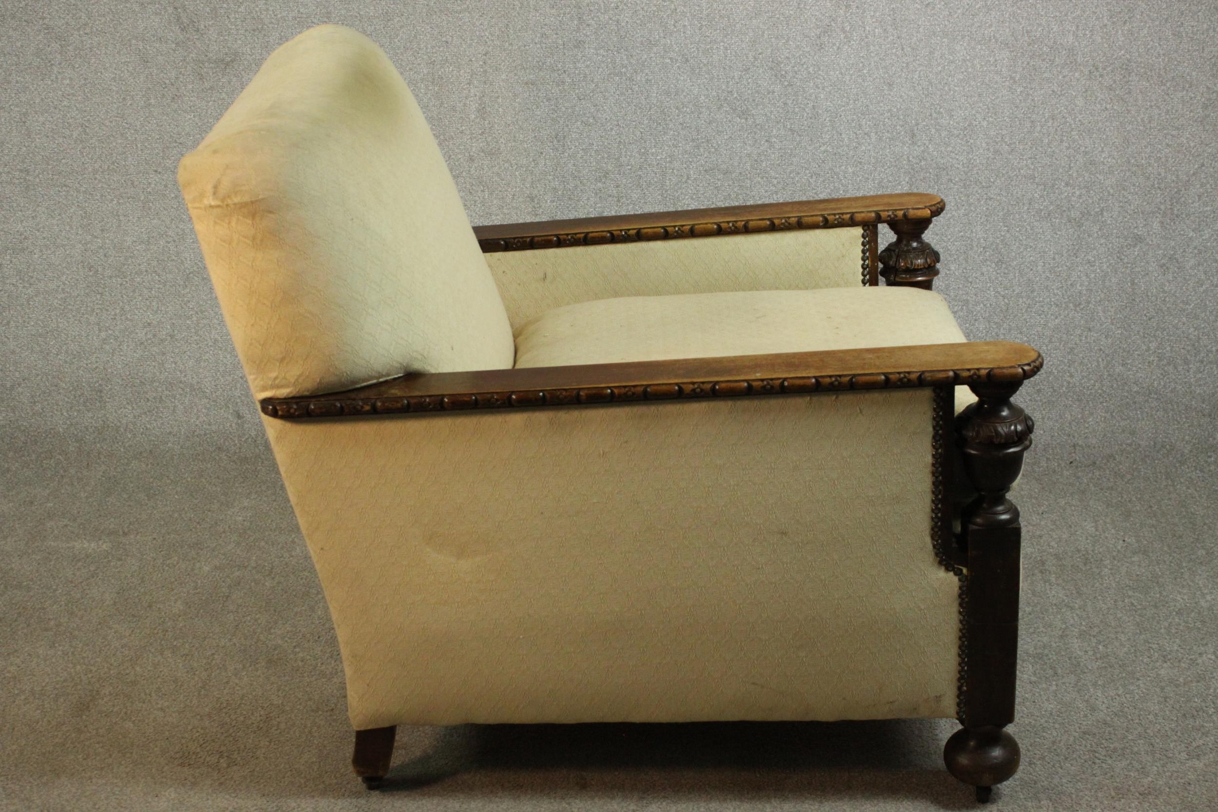 A pair of early 20th century oak armchairs, upholstered in cream fabric, with carved cup and cover - Image 6 of 10