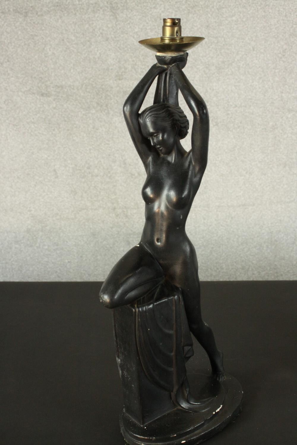 An Art Deco style black painted plaster table lamp in the form of a nude dancer perched on a - Image 5 of 6