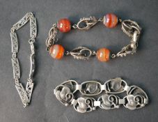A silver foliate design articulated bracelet by Carl Johan August Varde, along with an art nouveau