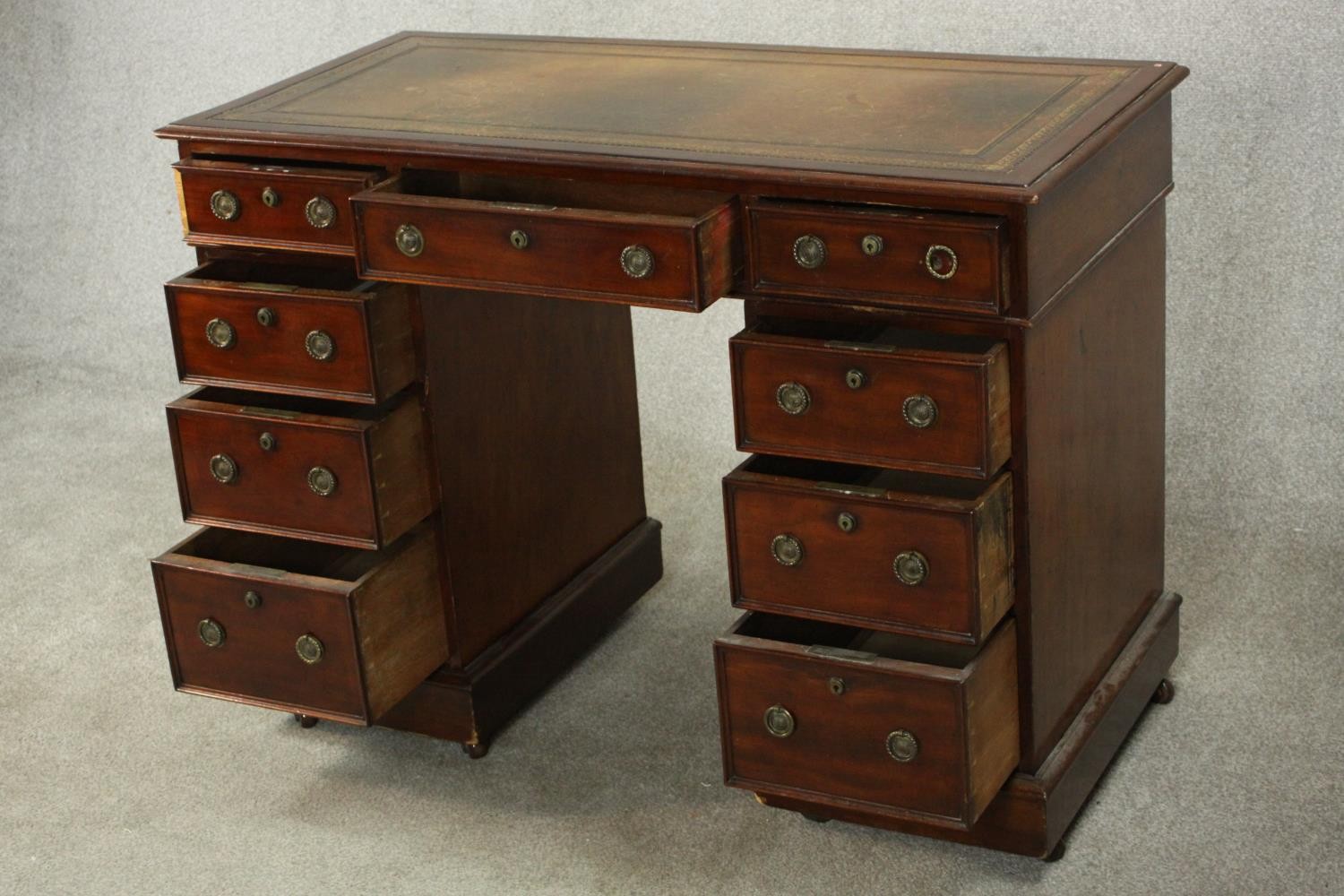 A small C.1900 mahogany pedestal desk, with a tooled green leather writing insert over an - Image 6 of 9