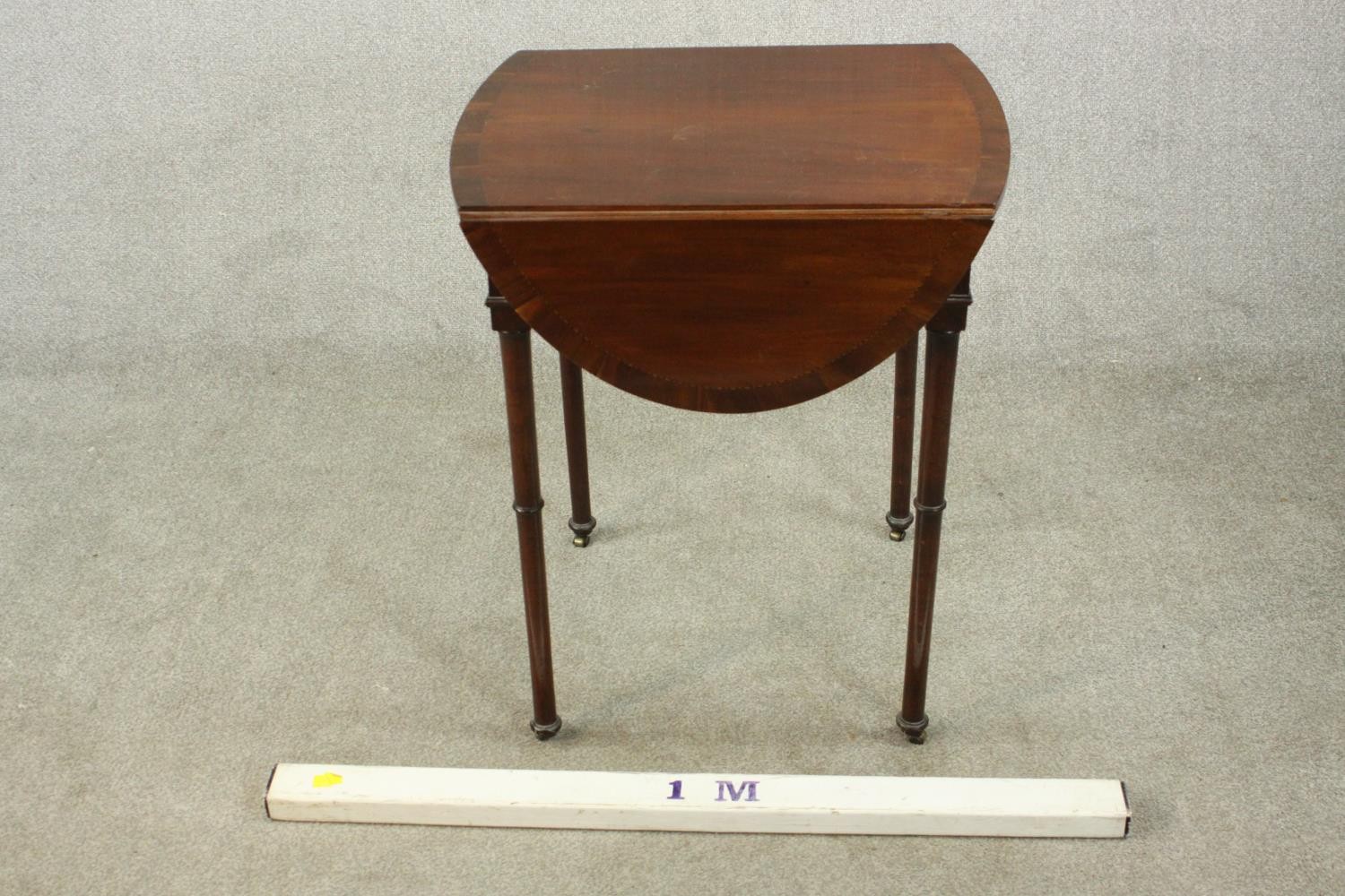 A mahogany drop leaf Pembroke style table, the oval top with a crossbanded edge, on turned legs. H. - Image 2 of 10
