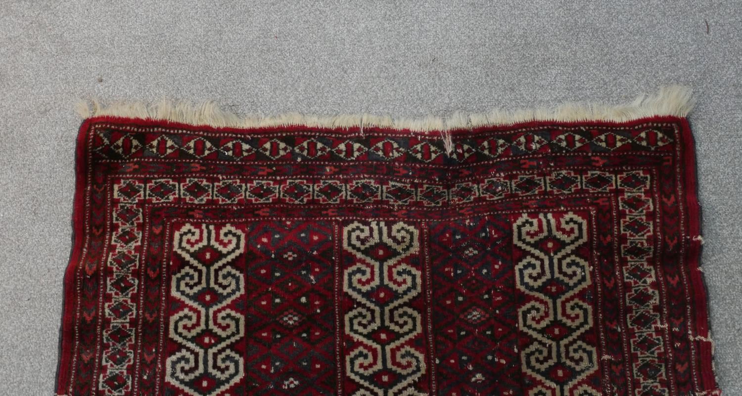 A red ground handmade Persian Turkman rug. L.115 W.100cm - Image 5 of 7