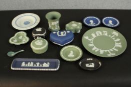 A collection of Wedgwood Jasperware items, in hues of green, blue, black and white, including