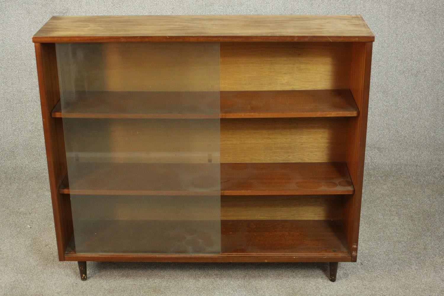 A circa 1960s Jonell bookcase, with a pair of glass sliding doors enclosing shelves, on tapering - Image 3 of 7