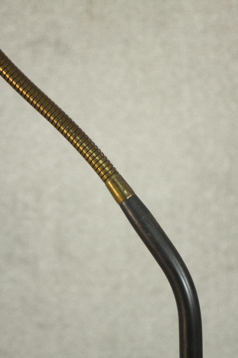 A 1950's standard lamp, with an adjustable brass arm on a black painted stem with a circular black - Image 4 of 5