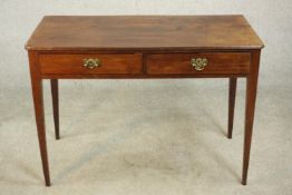 A George III mahogany side table, the rectangular top with reeded edge, over two short drawers, on