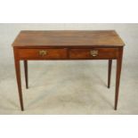 A George III mahogany side table, the rectangular top with reeded edge, over two short drawers, on