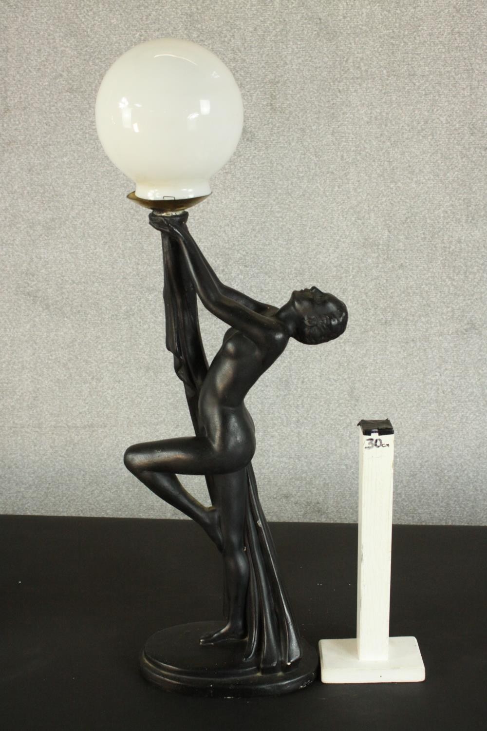 An Art Deco style black resin table lamp in the form of a nude dancer with white glass globe - Image 6 of 6