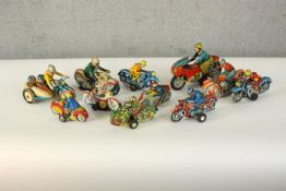 A collection of eleven vintage Japanese and Chinese wind up tin plate racing motorbike toys. H.15