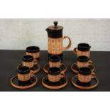 Gordon Fox for Kentmere pottery; a stoneware coffee set to seat six, with dark brown glaze and