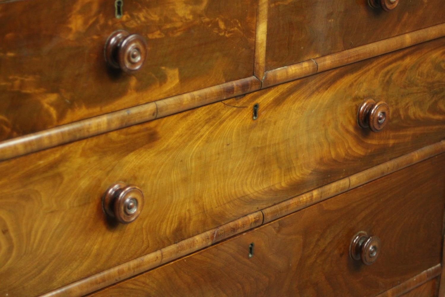 A 19th century flame mahogany chest of two short over three long drawers with knob handles, on - Image 5 of 8