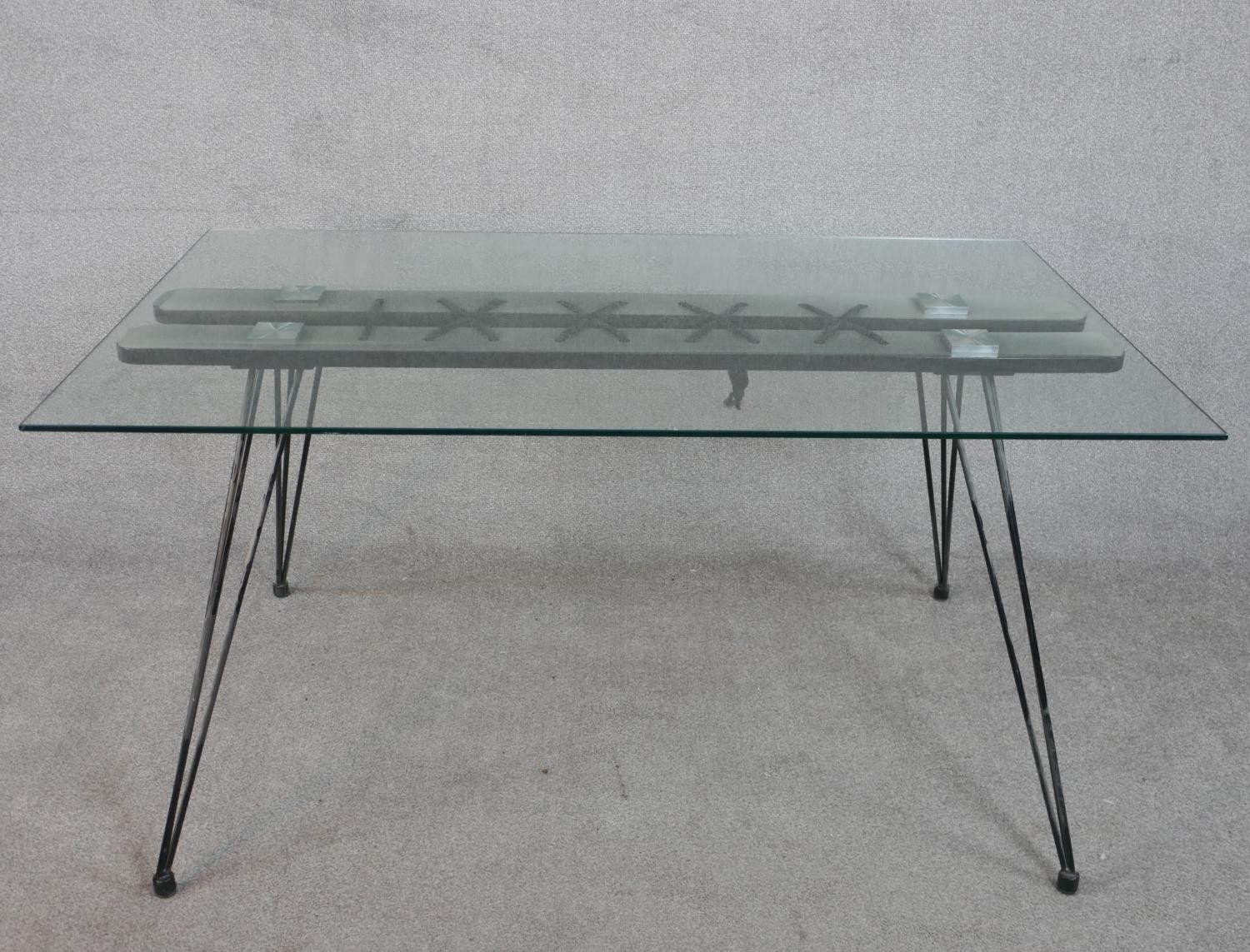 A 20th century dining table, with a rectangular plate glass top, the base woven together with rope