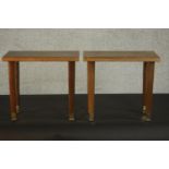 A pair of occasional tables, with a later rectangular top on square section tapering legs with brass