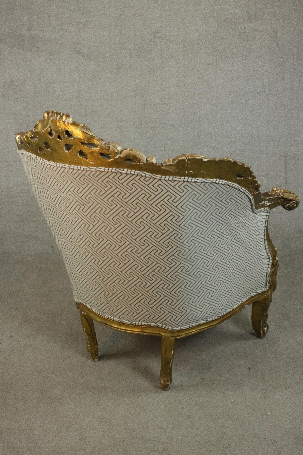 A pair of Louis XV style carved giltwood armchairs, 20th century, upholstered in beige fabric, - Image 5 of 10