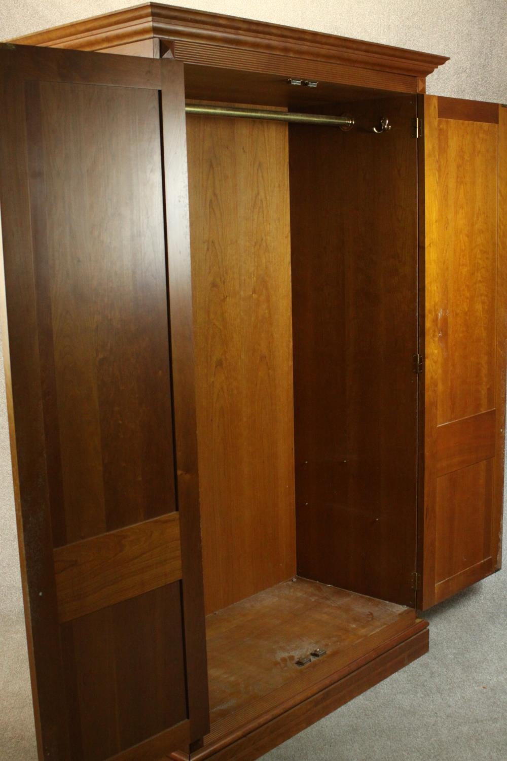 A late 20th century cherrywood wardrobe, with a pair of panelled doors opening to reveal hanging - Image 12 of 13