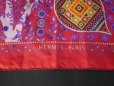 A Hermes L' Arbre de Vie silk scarf on pink ground. L.87 W.87cm